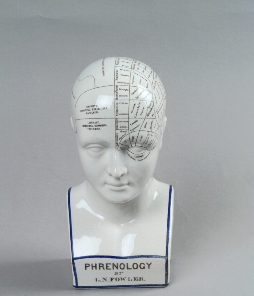 Ceramic phrenological bust, white with transfer lettering, black and blue lining. On bottom front: `Phrenology by L.N. Fowler/L.N. FOWLER/LUDGATE CIRCUS/LONDON/ENTERED AT STATIONERS HALL'. On back in black lettering: `FOR THIRTY YEARS I have studied crania and living heads from all parts of the world and have found in every instance that there is a perfect correspondence between the confirmation of the healthy skull of an individual and his known characteristics. To make my observations available I have prepared a bust of superior form and marked the divisions of the organs in accordance with my researches and varied experience. L.N. Fowler. (OF) 